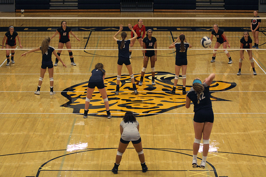 The Lady Jags serve the ball on Tuesday, Oct. 6. Lansing defeated the Lady Jags 3-1.