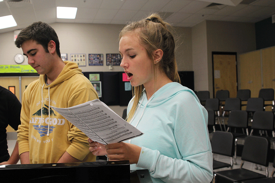 Sophomores McKenna Harvey and Simon Stewart rehearse their songs after school on Tuesday, Oct. 6 for their lead roles in “Oklahoma!” this fall.