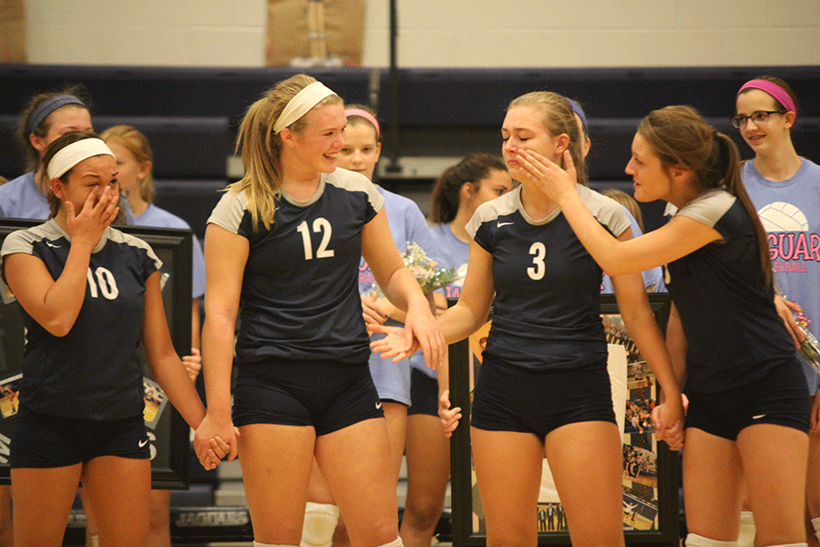 Seniors Marisa Macias, Catie Kaifes, Lizzy Eber and Natalie Brinker stand together before they are recognized at senior night. The Lady Jags beat Piper 3-0. 