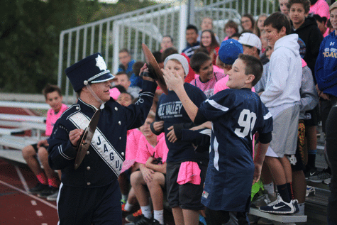 Matt high-fives a middle school boy during the game.