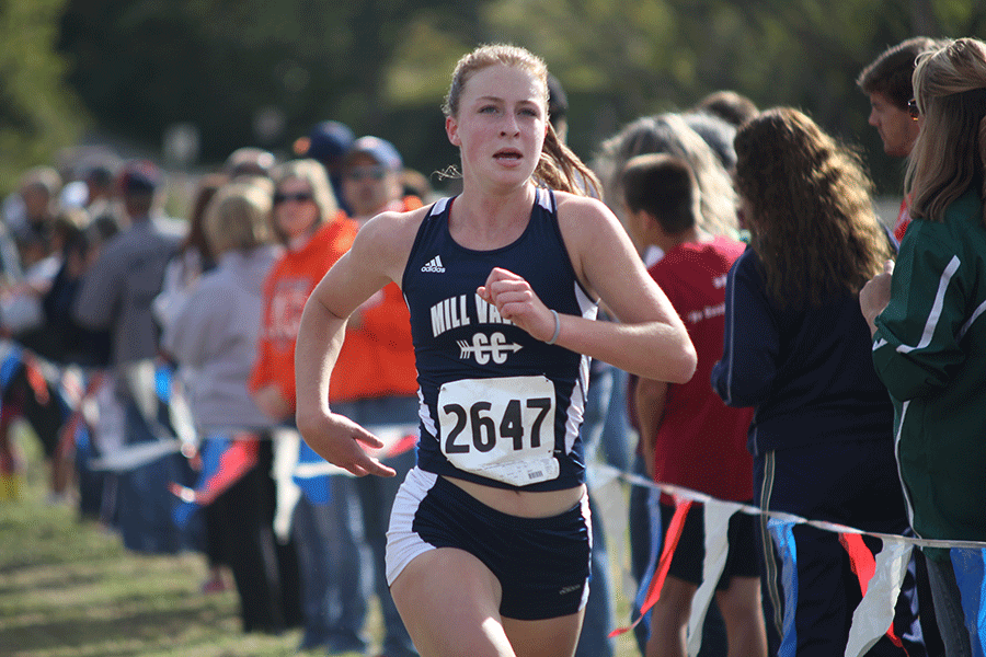 As she passes pennant flags, family and friends, senior Ellie Wilson sprints to the end of the race in order to be Mill Valleys first finisher on Saturday Oct. 9 at Shawnee North Community Park. Id had season after season of something always hav[ing] to go wrong, so it was nice to have a season that went right, Wilson said. And then for Cross Country it was just nice to be back running and knowing that my body could go that far.