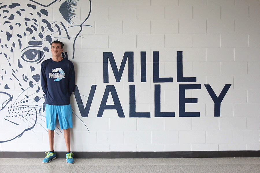 Junior Travis Collins proudly wears his Mill Valley swim team spirit wear.taylar