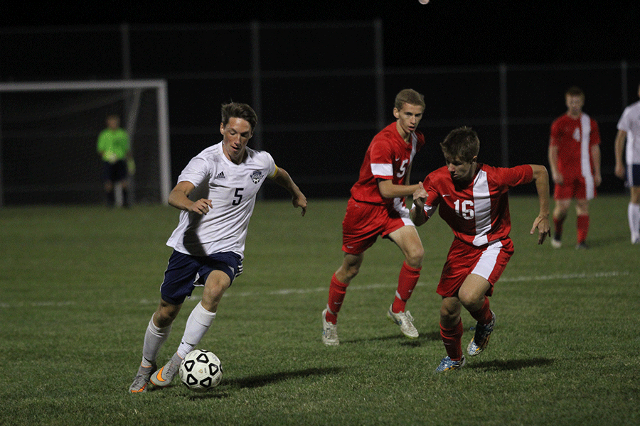 Junior defender Hayden Vomhof keeps the ball away from his opponent. 