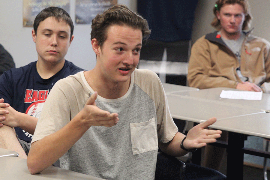 After the Umpqua Community College shooting, junior Ethan Hansen argues about gun control at a Political Debate meeting on Wednesday, Oct. 7. Political Debate meets during seminar on Wednesdays in sponsor Chris Dunbacks room to discuss current political issues.