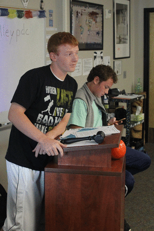 Intently listening, senior Political Debate president Brenden Shutt leads the meeting on Wednesday, Oct. 7.