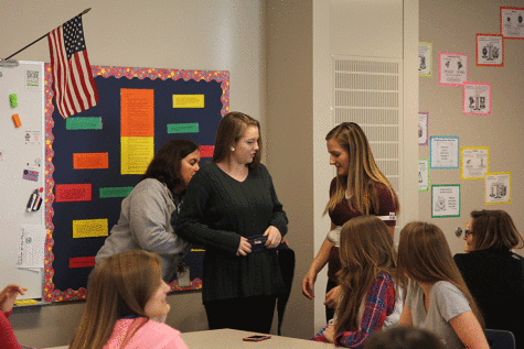 Students use empathy bellies to replicate the weight of pregnancies