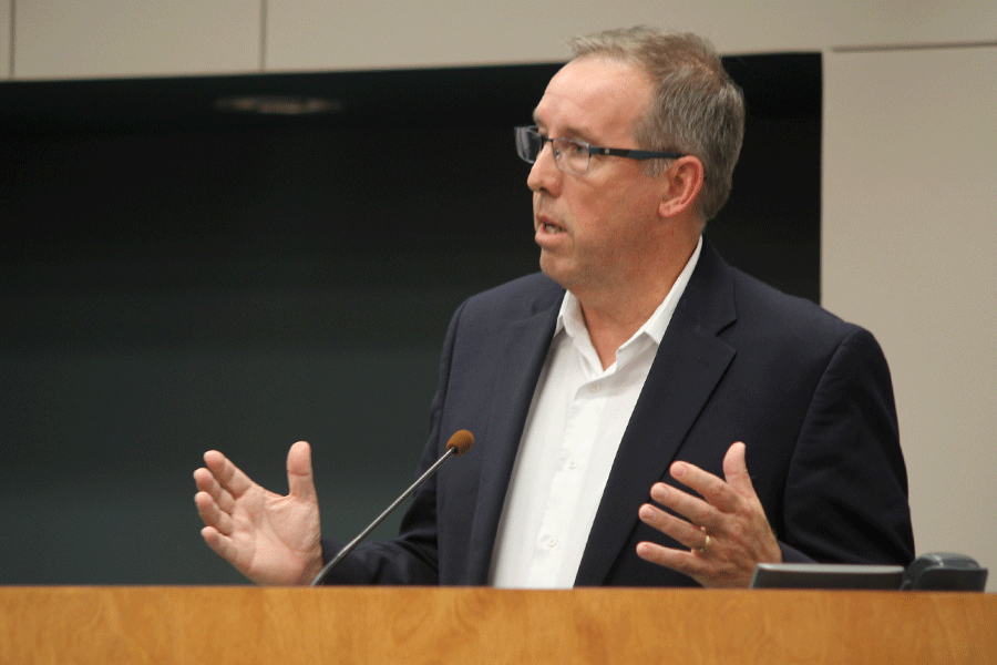 Gesturing with his hands, Board candidate Dave Anderson explains his plans for the district. 