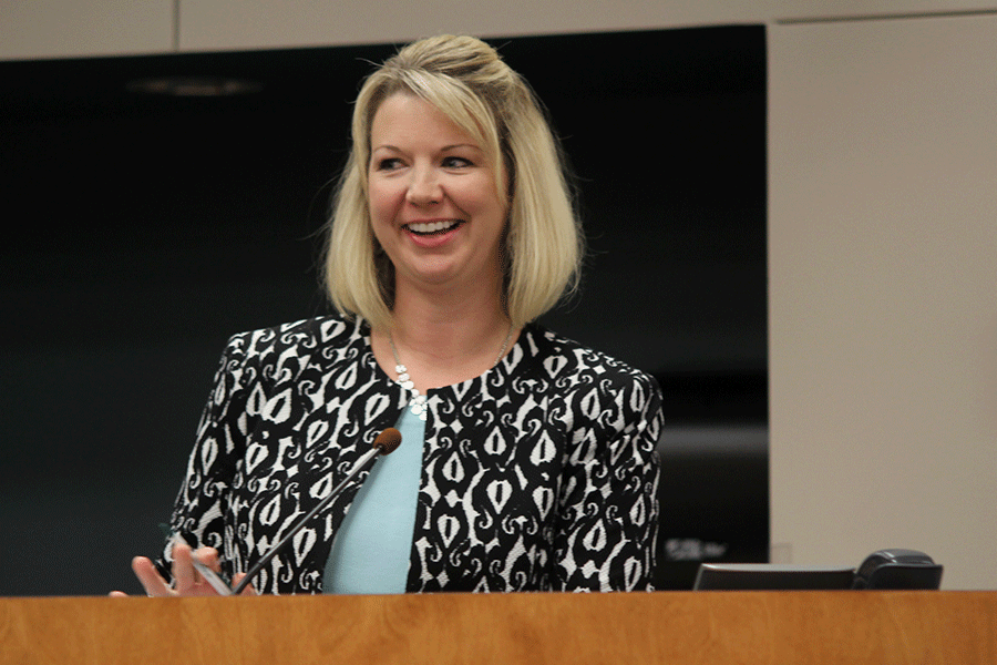 Board candidate Danielle Heikes smiles after introducing herself to the Board. 