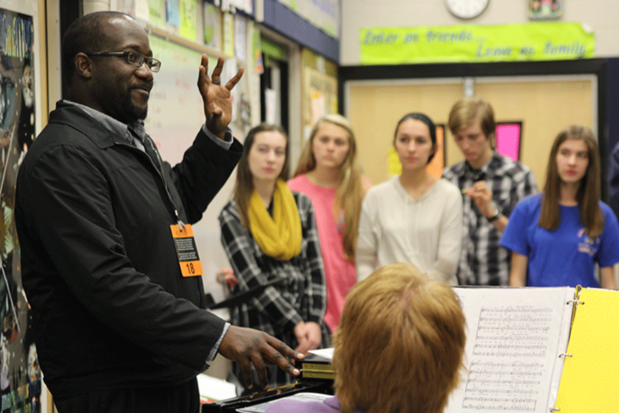 During+choir+on+Wednesday%2C+Nov.+11%2C+clinician+John+Stafford+helps+the+Jag+Chorale+students+prepare+for+their+winter+concert.