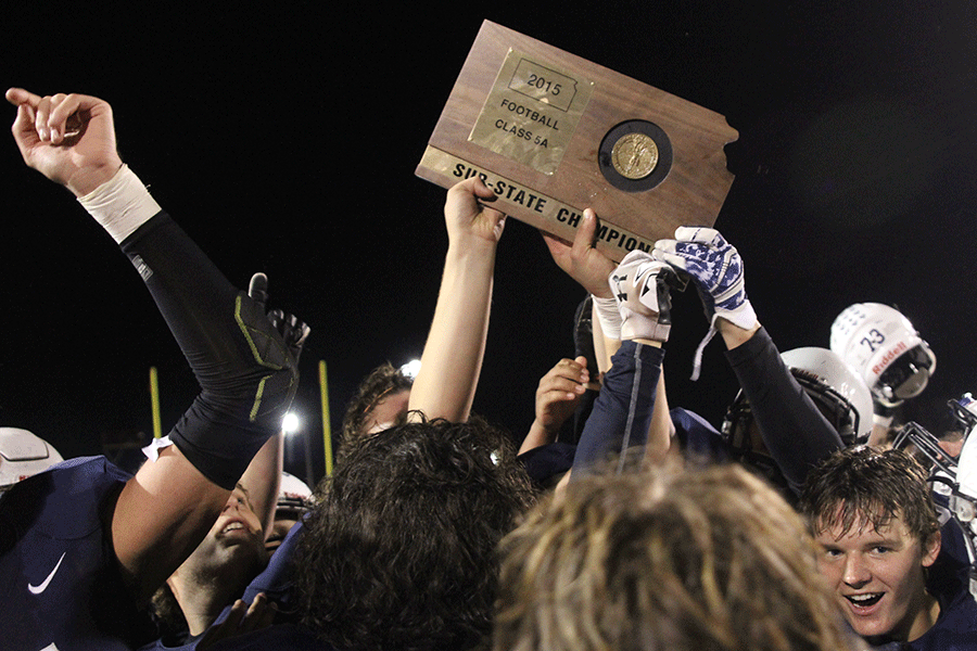 Following a 45-28 win over the St. Thomas Aquinas Saints, Jaguar football players and fans celebrate after receiving the sub-state champions plaque on Friday, Nov. 20. The Jaguars will play for the state title for the first time in school history against Bishop Caroll on Saturday, Nov. 28 at Carnie Smith Stadium, Pittsburg State University.