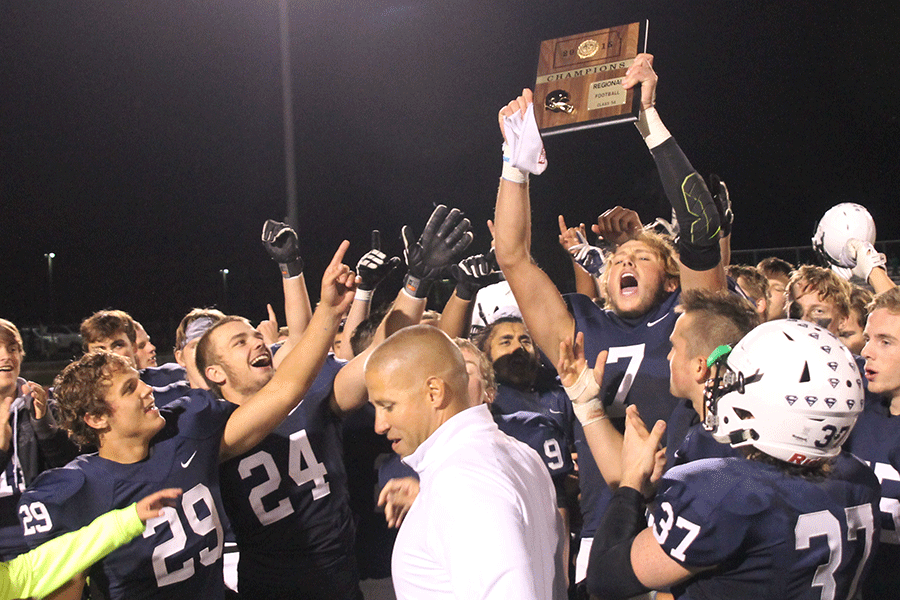 Senior Lucas Krull hoists up the regionals trophy in celebration of a 49-0 win over the Leavenworth Pioneers in the first round of playoffs on Friday, Nov. 6. The Jaguars will advance to play the Pittsburg Purple Dragons in the sectional round of playoffs at Pittsburg on Friday, Nov. 13. “We know what's on the line,” senior Lucas Krull said. “We got to go out there and we just need to show everyone what we are about.”
