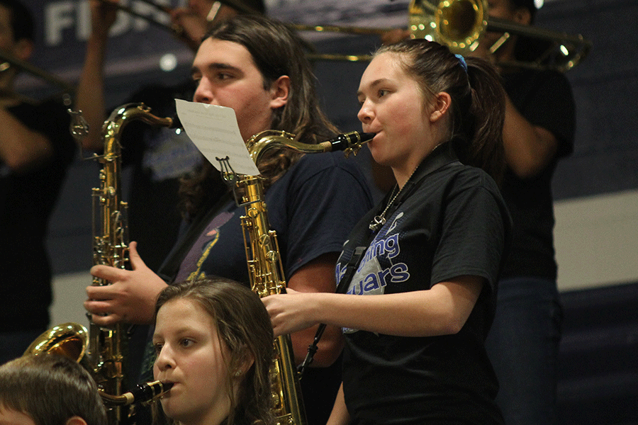 Band members play the fight song.