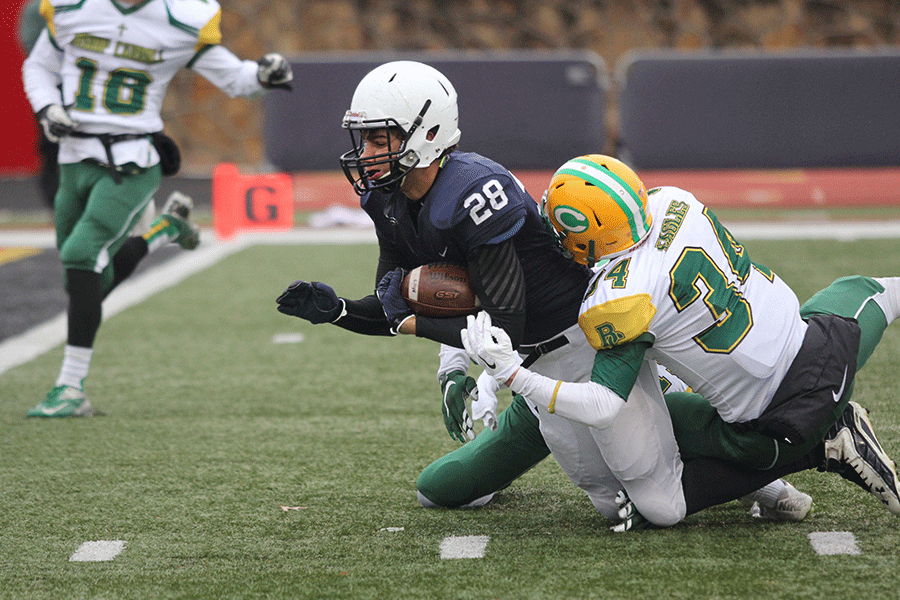 Sophomore running back Ike Valencia attempts the touchdown.