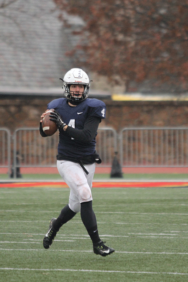 Senior quarterback Logan Koch gets ready to pass the ball.