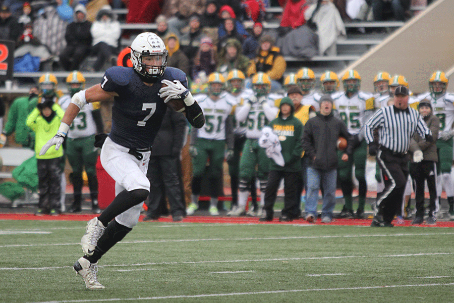 Senior wide receiver Lucas Krull runs the ball down the field.