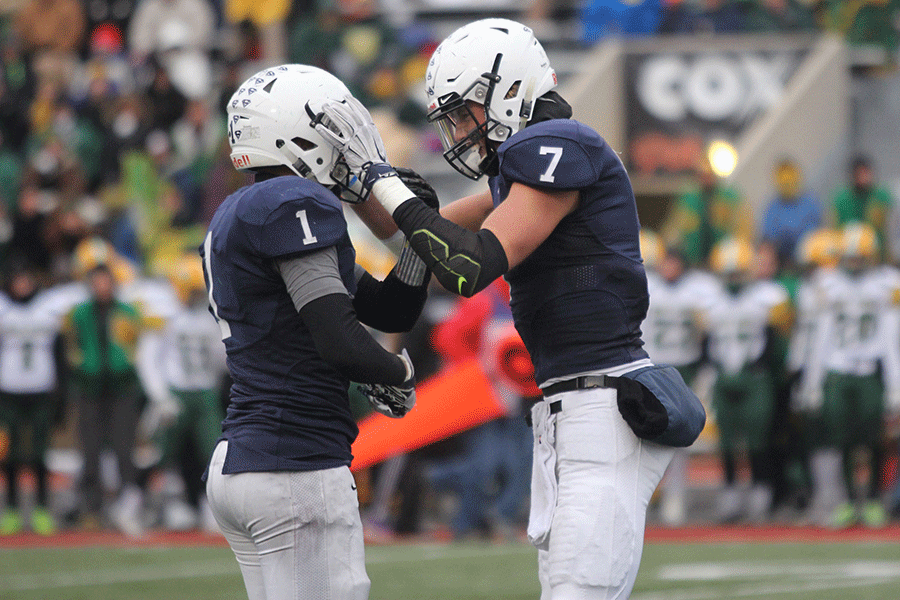 Seniors Christian Jegen and Lucas Krull celebrate after a touchdown by the Jaguars.