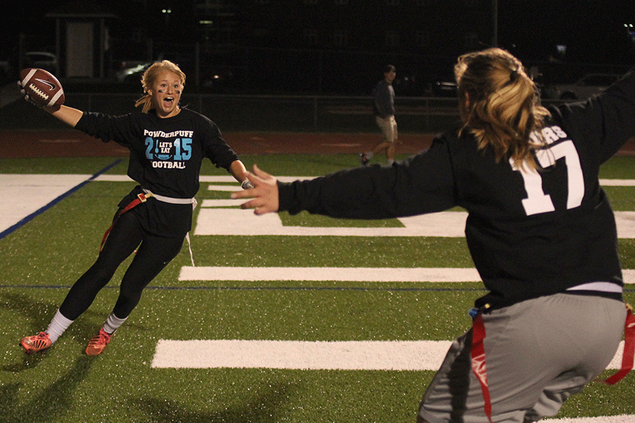 After scoring a touchdown, junior Courtney Carlson celebrates with her teammates.