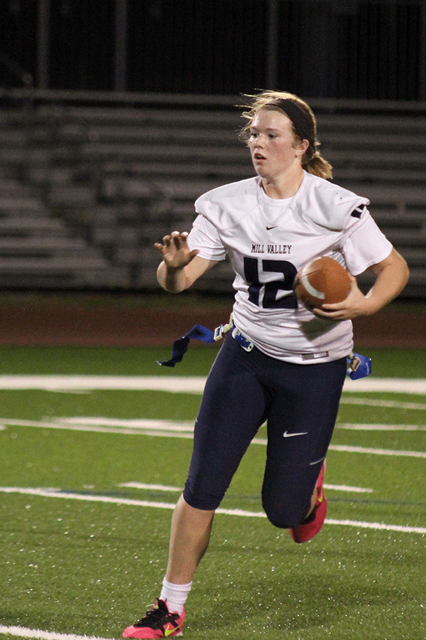 Senior Catie Kaifes runs the ball down the field to score a touch down for the seniors.