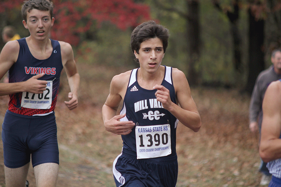 With eyes focused ahead, sophomore Gavin Overbeck competes in the state cross county meet at Rim Rock Farm on Saturday, Oct. 31.