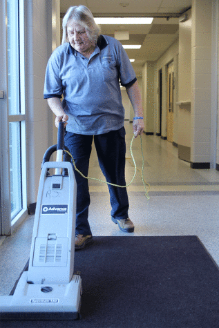 At the end of the school day, custodian Rhonda Jensen begins vacuuming the doormats in C-wing on Friday, Nov. 6.