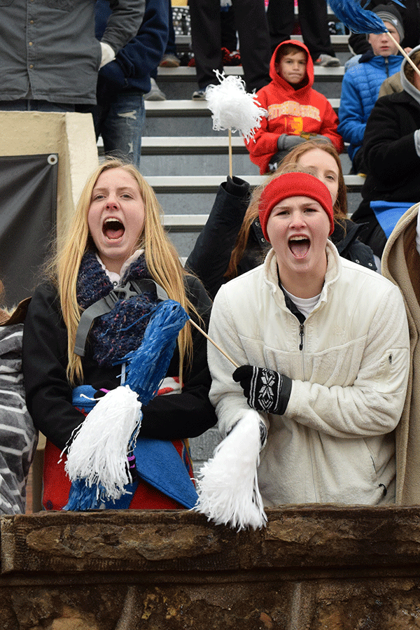 Freshman Lexi Ballard and Claire Kaifes cheer as the Jaguars score a touchdown. 
