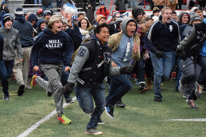 The student section stormed the field after the presentation of the state championship trophy. 