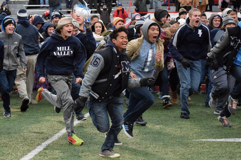 The student section stormed the field after the presentation of the state championship trophy. 