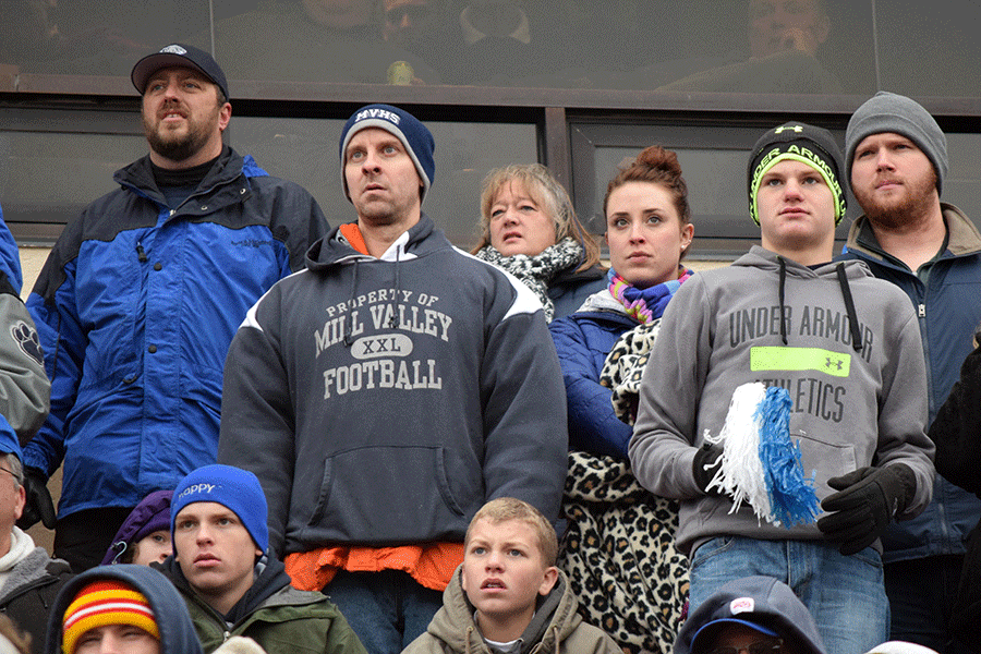 Mill Valley fans watch as the Bishop Carroll Golden Eagles gain yardage.