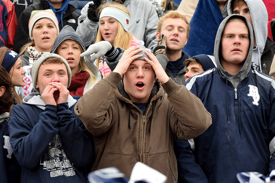 Seniors Jeremiah Kemper, Will Dervin and Tyler Grauer watch in disgust as Bishop Carroll scores a touchdown. 
