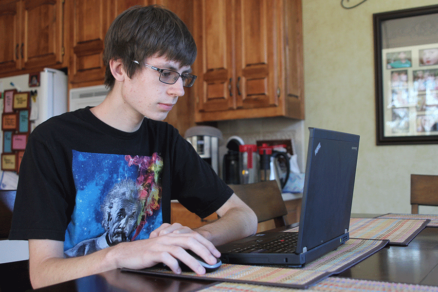 After updating his computer, senior Patrick Gambill browses it on Saturday, Nov. 7. “I put in a new RAM [and] a new battery,” Gambill said. “I also upgraded the OS.”
