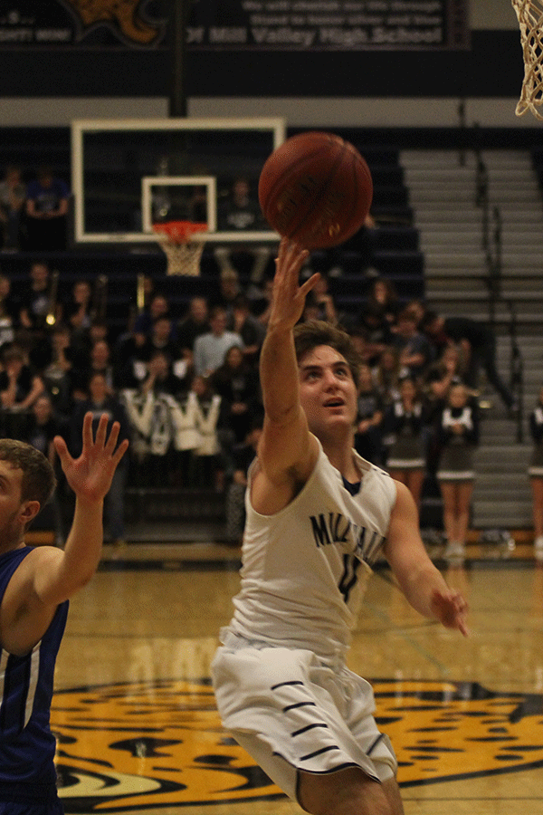 Senior Logan Koch shoots for a basket.
