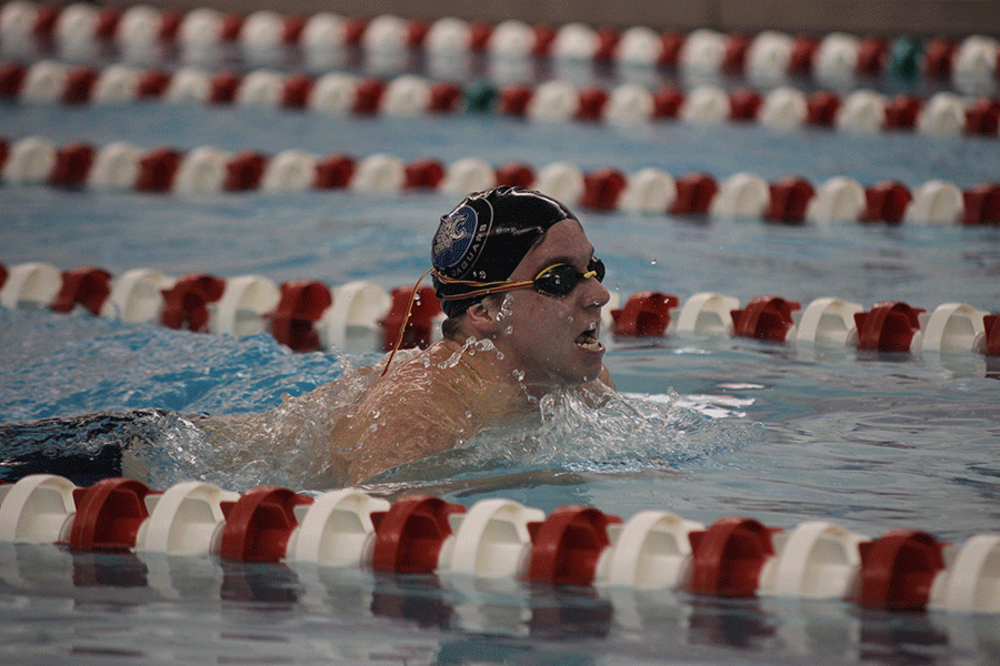 Senior Brendan Tener swims breaststroke in the first meet of the season.