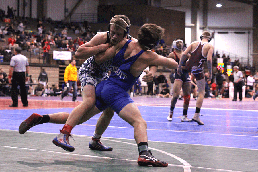 While competing in the KC Stampede tournament, senior Ryan Anderson wrestles his opponent.