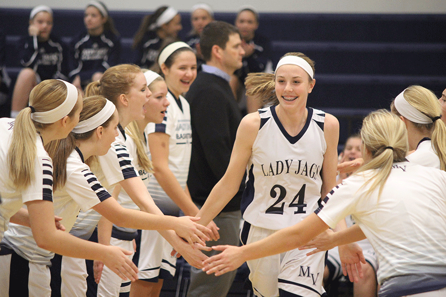 When the announcer calls her name, sophomore Evan Zars runs onto the court and high fives her teammates. The Lady Jags beat Bishop Ward 64-14.