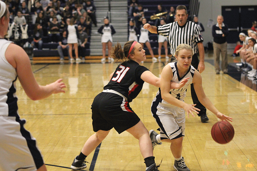 Sophomore Adde Hinkle tries to advance the ball to the basket.