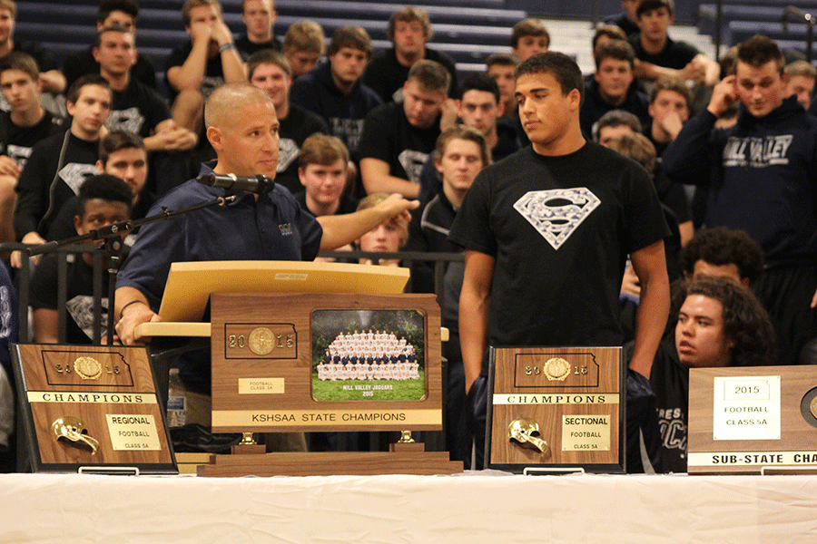 Head football coach Joel Applebee announces senior Christian Jegens Kansas Gatorade Football Player of the Year award. 