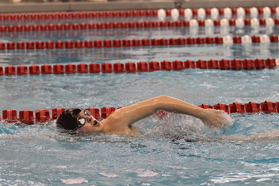 Junior Spencer Smith participates in the 50 yard freestyle. 