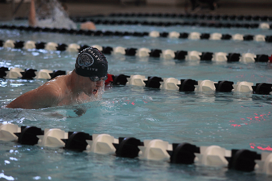Freshman Jakob Twigg swims breaststroke in the 200 yard medley relay.