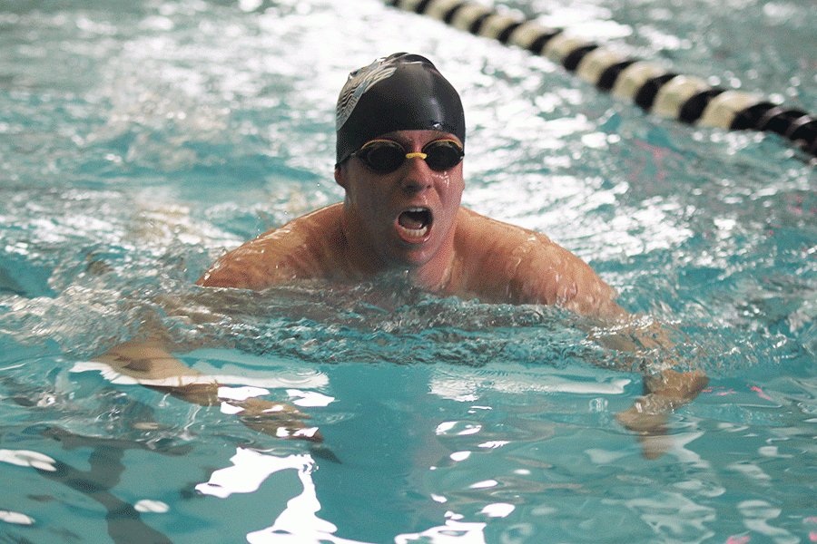 Senior Brendan Tener comes out of the water during the 200 yard IM. 