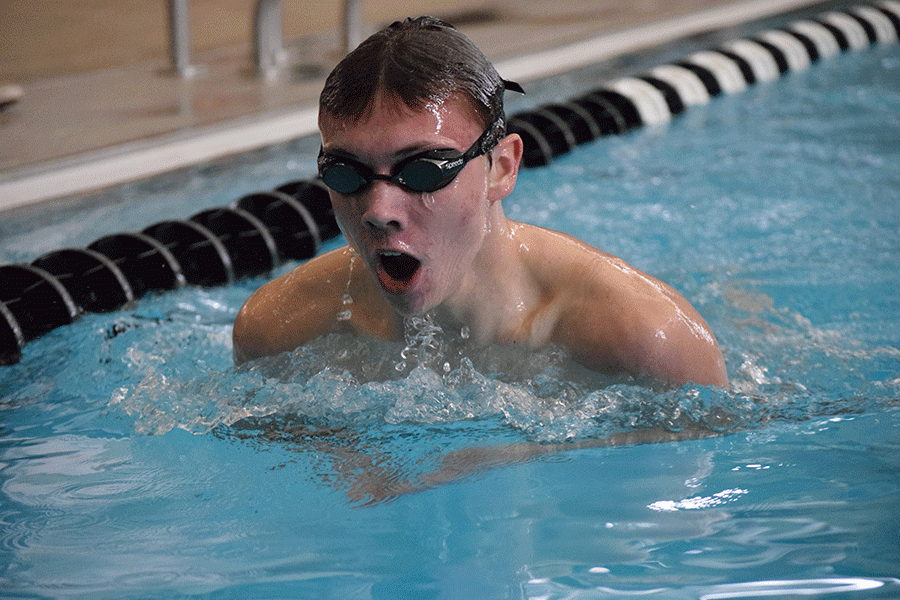 Senior Jeremiah Kemper takes a breath during the 200 yard IM race at Blue Valley Southwest High School on Saturday, Jan. 23. 