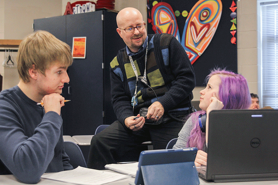 Drama teacher Jon Copeland talks to sophomore Victoria Freshwater and senior Trevor Molz about set design. Copeland will direct the school's second performance of "A Midsummer Night's Dream" this year after he previously directed it four years ago.