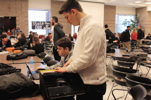 Brothers and teammates Nick and Jack Booth prepare for their next debate in between rounds.