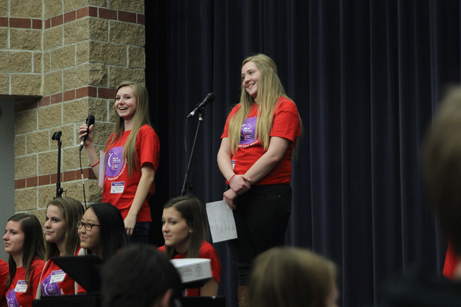 Seniors Megan Feuerborn and Isabel Crain discuss to crowd of students and staff about Relay for Life event, on Wednesday, Jan. 27.