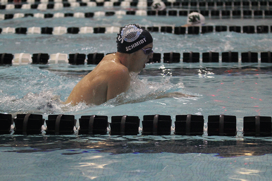 Senior Logan Schmidt comes up for air as he swims the breaststroke. 