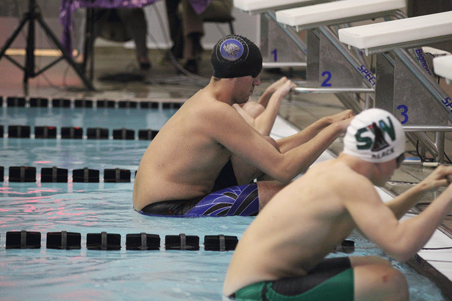 Preparing for the race, senior Brennan Teasley presumes his starting position. 