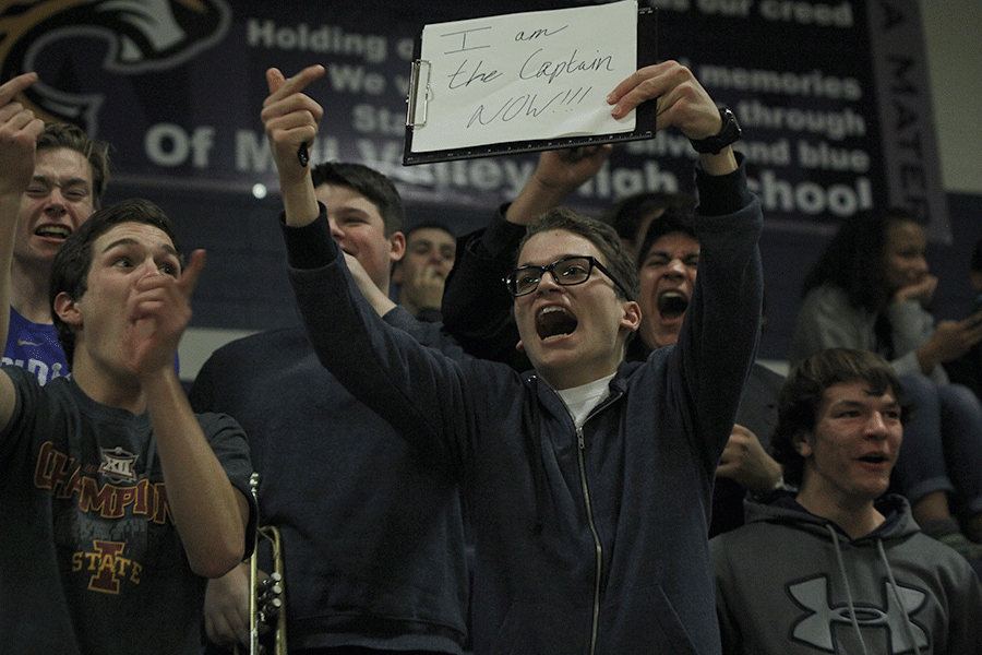 Junior Braden Shaw cheers after the team scores. 