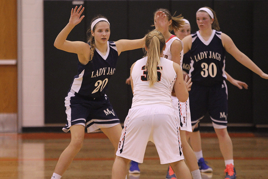 Blocking the ball, freshman Trinity Knapp keeps the Braves player from getting the ball to the net. The Lady Jags lost 44-47 against the Bonner Springs Braves.