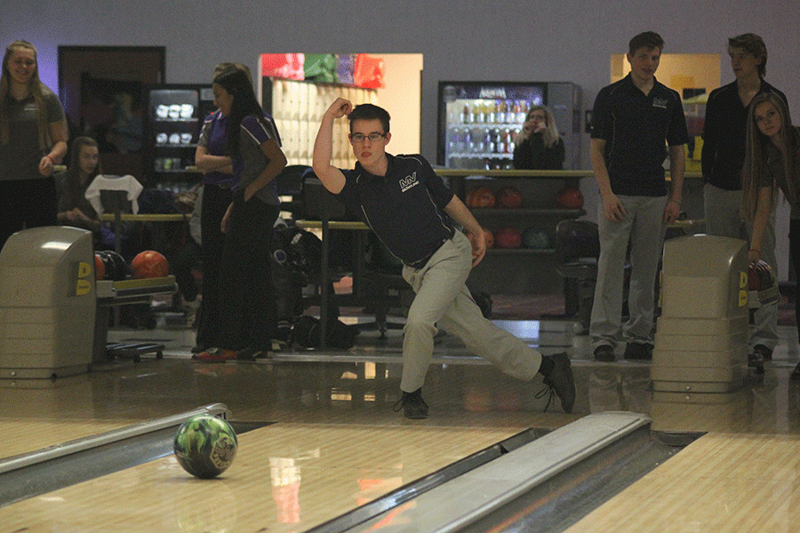 Junior Jayden Moore bowls during his warm-up. 