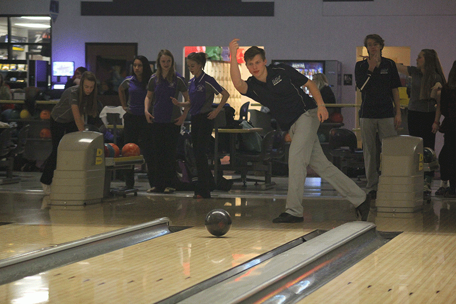 Senior Brock Miles warms up before the bowling meet. 