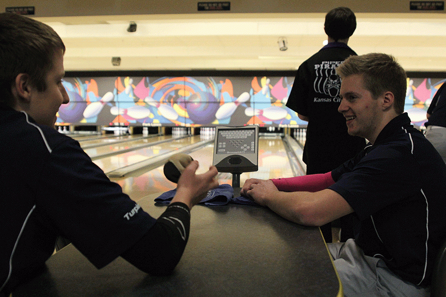 Junior Marc Hinnon converses with a teammate during competition. 